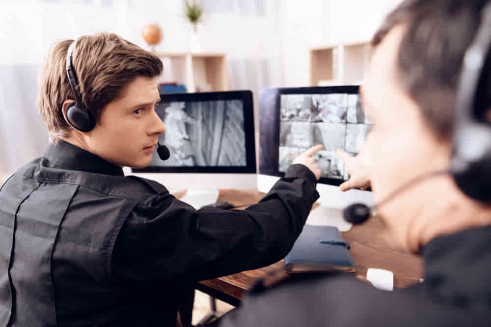 two serious men work security in office 1